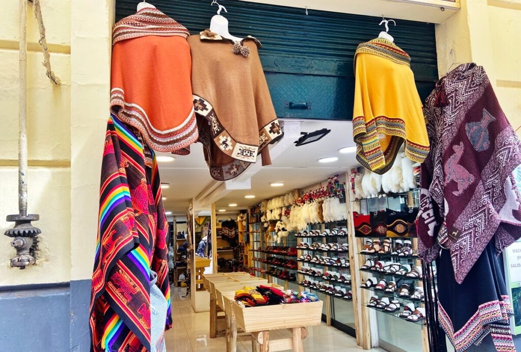 is cusco worth visiting - alpaca ponchos in cusco