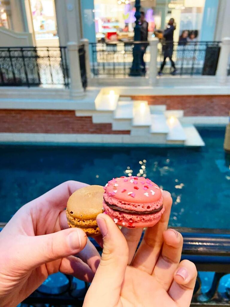 girls' trip to Las Vegas eating a macaron in las vegas
