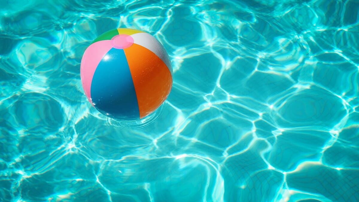 palm springs packing list - inflatable ball in pool
